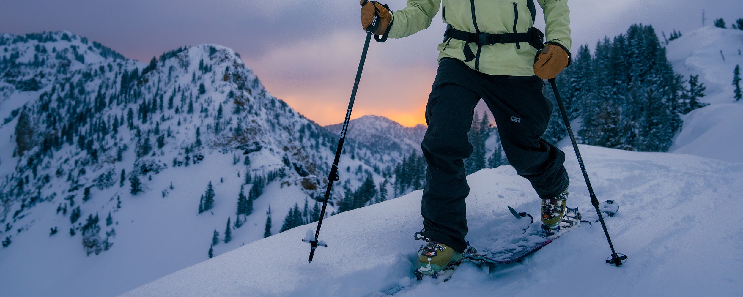 A woman heads out on a twilight ski tour.