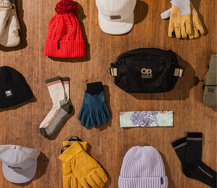 Overhead view of Outdoor Research gloves, beanies, and accessories.