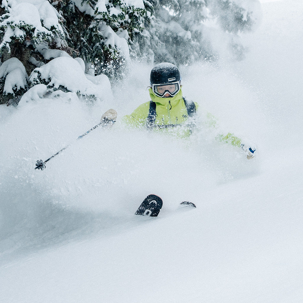 Olympic athlete Zoe Atkin skies fast downhill wearing Outdoor Research Skytour AscentShell Jacket in Cool Matcha. 